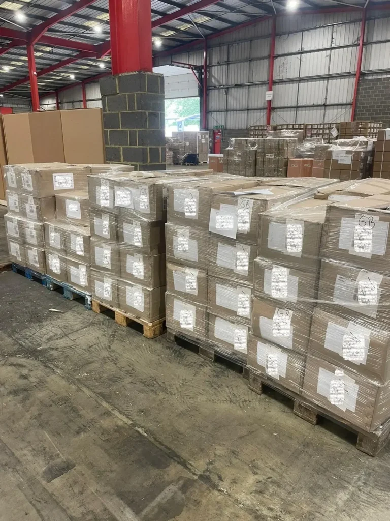 Pallets shrink wrapped and lined up in a warehouse for shipping via air freight to Brazil