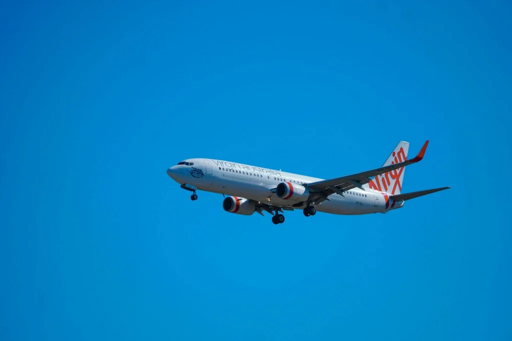 Virgin Atlantic Plane in flight on blue sky background