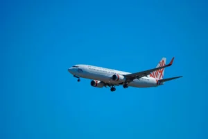 Virgin Atlantic Plane in flight on blue sky background