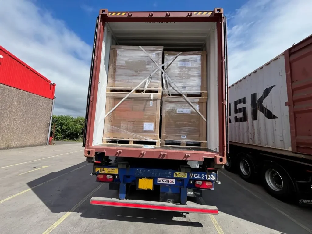 Shipping container open loaded with crates on pallets for sea freight to australia