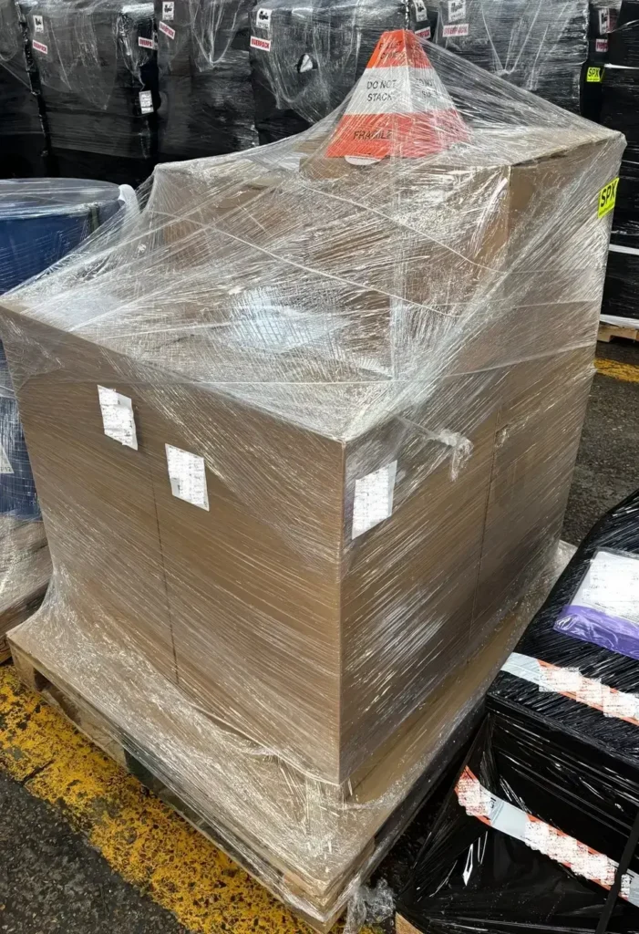 Shrink wrapped pallet with non-stack cone for air freight to USA