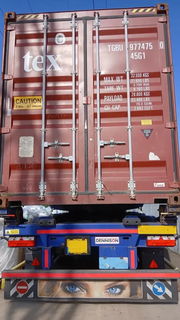 Shipping container on a truck, doors closed, for sea freight from Vietnam