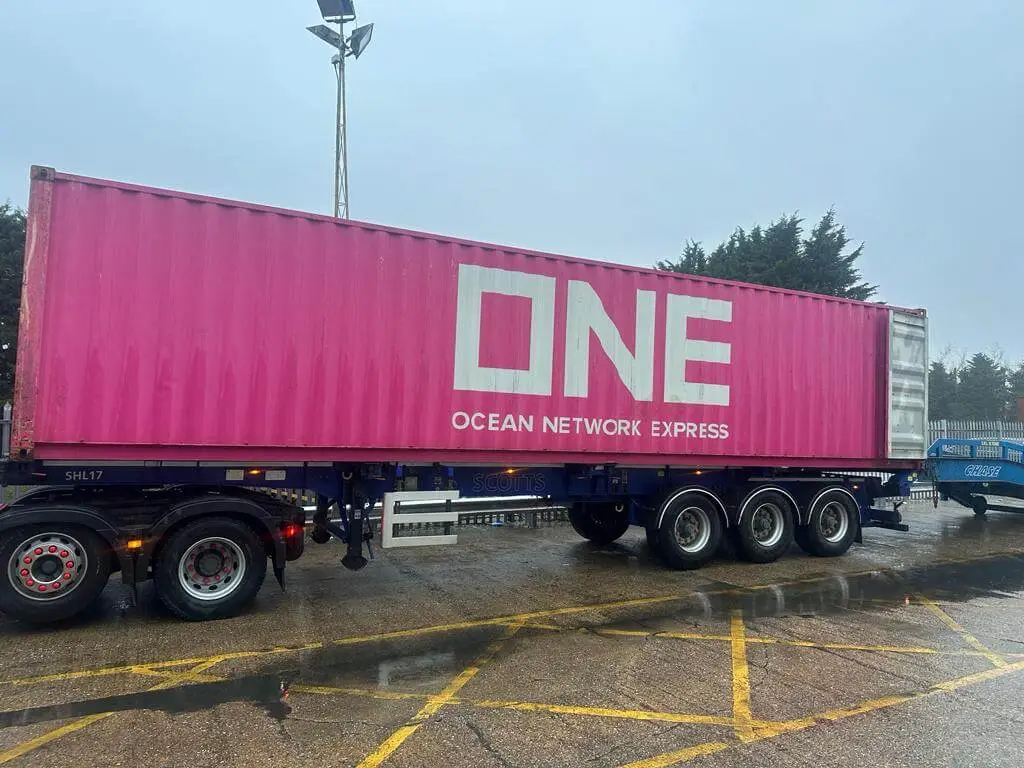 Side on view of an unloading shipping container, shipping from USA to UK