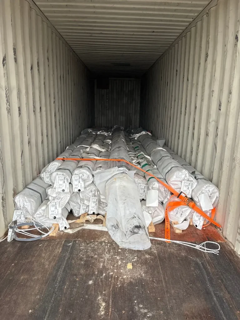 Stainless steel tubes loaded and lashed in a 40' shipping container for importing from South Korea